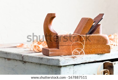 old wooden plane in a workshop of the carpenter