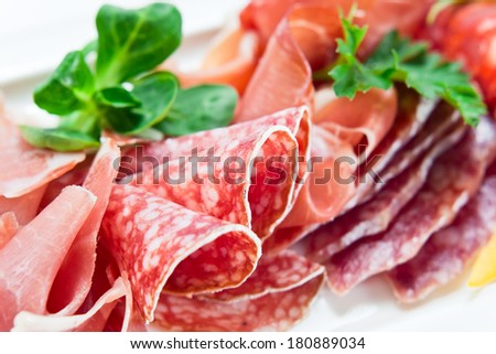 ham and sausage  on a white plate