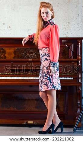 The young beautiful woman in pink blouse