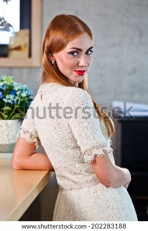The young beautiful woman in knitted dress