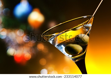 dry martini with olives ,focus on a berry