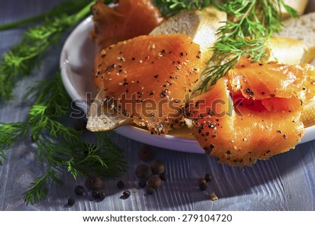 smoked salmon with bread , dill and pepper
