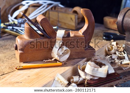 old wooden plane in a workshop of the carpenter