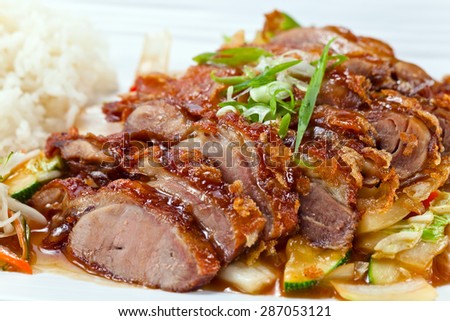 Roasted meat with vegetables and rice.  Korean cuisine.
