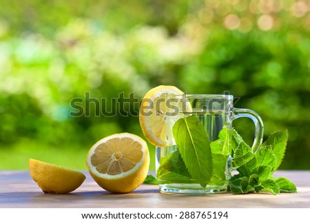 peppermint tea with lemon on wooden table