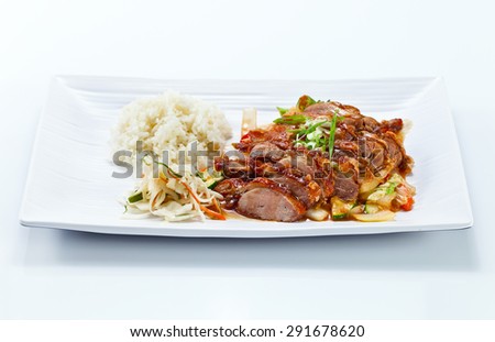Roasted meat with vegetables and rice.  Korean cuisine.