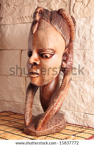 Ancient wooden sculpture from Africa. A head of the woman.