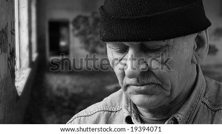 old man in black hat