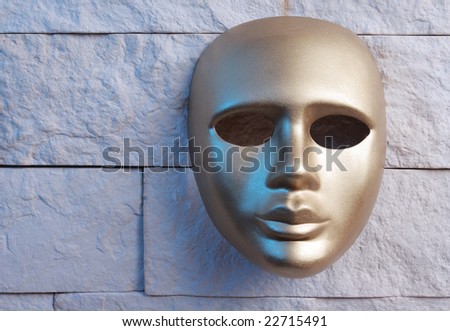 gold mask on a wall