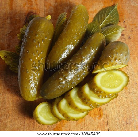 preserved  cucumbers on a wooden table