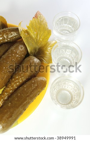 Wine-glasses with vodka and preserved  cucumbers