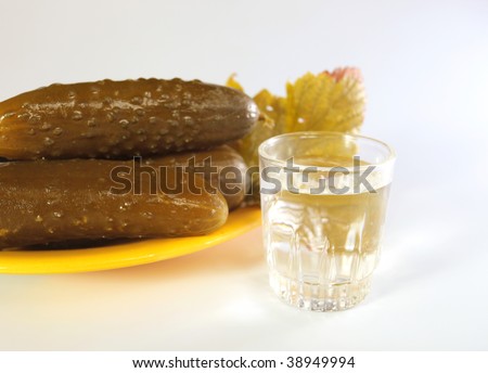Wine-glass with vodka and preserved  cucumbers