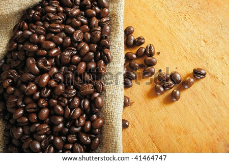 Roasted beans of coffee in a bag