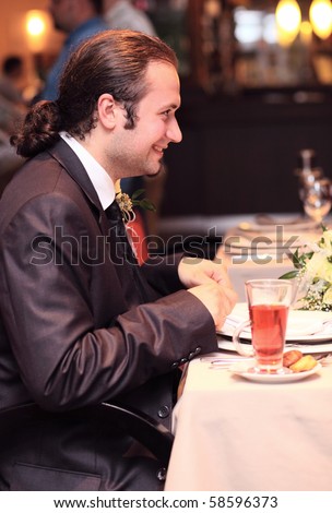 the smiling man in restaurant