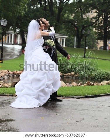Wedding in park under a rain