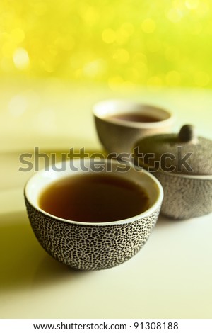 Black tea in small Japanese cups.