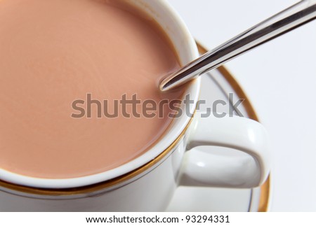 Chocolate milk in white mug, macro shot.