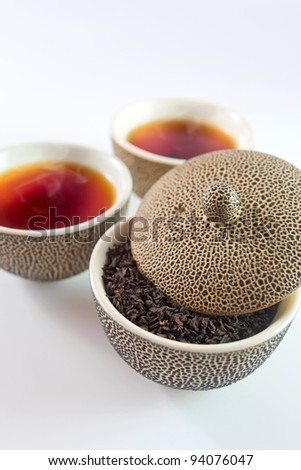 Black tea in small Japanese cups.