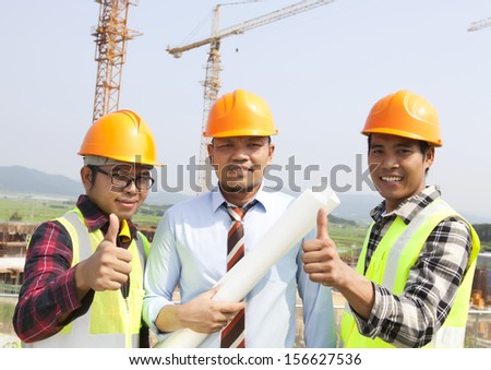 Construction teamwork giving thumbs up