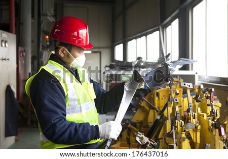 Industrial engineer checking quality metal