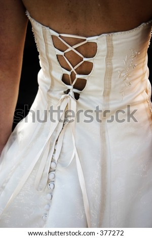Criss crossed wedding dress. shot of the bride\'s back