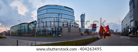 Warsaw, Poland - March 28, 2016: Kasprzaka street, Office building Warsaw Spire under construction in Warsaw, Poland. Warsaw Spire is a modern landmark and a powerful symbol of Warsaws energy. The