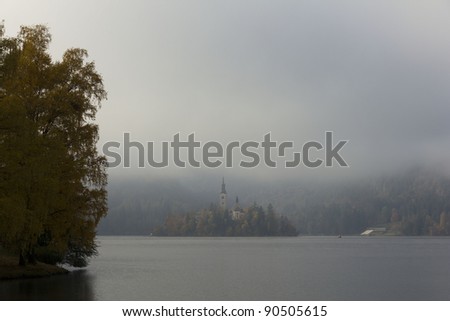 Church on a foggy lake