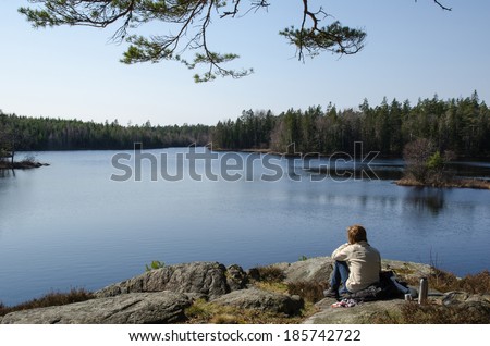 Women resting by the lake at the swedish province Smaland
