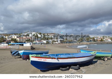 SAN AUGUSTIN, GRAN CANARIA, SPAIN - FEBRUARY 11: Small colorful fishing boats at the beach at San Augustin, Gran Canaria, Spain. Photo taken on February 11, 2015 in San Augustin, Gran Canaria, Spain