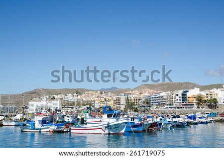 ARGUINEGUIN, GRAN CANARIA, SPAIN - FEBRUARY 17: View at the small boat harbour by the resort Arguineguin at the island Gran Canaria in Spain. Photo taken on February 17, 2015 in Arguineguin, Spain.