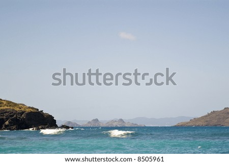This view of an island paradise could be any coastal region in the world. It\'s actually a view from Orient beach on the Caribbean island of St. Barts in the French West Indies.