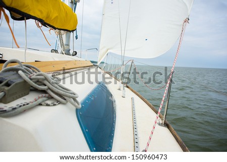 Image of the yacht is moving along the coast, selective focus
