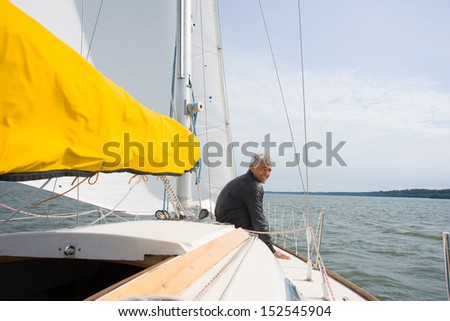 Image of Happy man in a yacht or sailing boat enjoying life