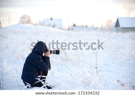 Image of Photographer in winter countryside