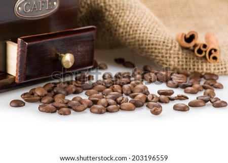 Image of Coffee beans closeup with coffee mill