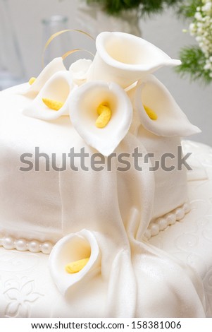 Sweet White Wedding Cake Decorated With Flowers
