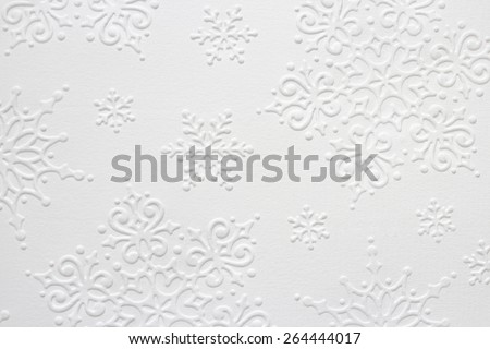 Embossed Snowflake Pattern on White Paper Structure