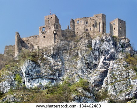 Summer view of famous Strecno Castle ruin sitting on massive rock formation located above Varin village. Strecno Castle is declared as national cultural monument and it is definitely worth a visit.