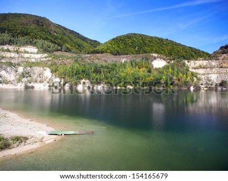 Scenic view of Sutovo lake during late summer. Crystal clear waters of Sutovo lake are popular holiday and vacation destination for tourists during summer in Slovakia.