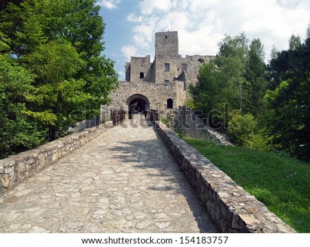 The old road made of stone leading to main gate and courtyard of famous Strecno Castle. The Strecno Castle is a ruin of gothic castle located near Zilina town in northern Slovakia.
