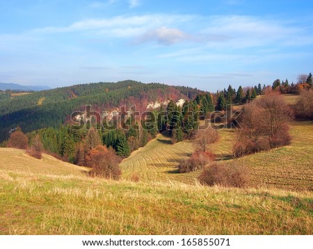 Felds and meadows of Tupa Skala location, part of Vysnokubinske Skalky, Slovakia. Rocks of Medzihradne can be seen in the distance. This location is important archaeological locality.