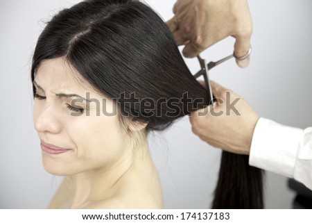 Woman feeling powerful to cut long hair to make a change