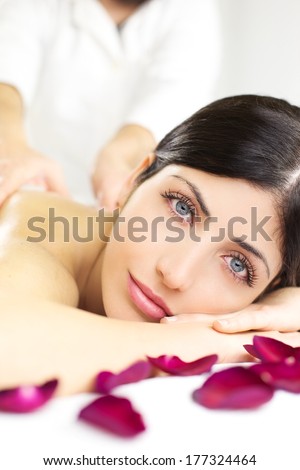 Gorgeous woman in luxury spa relaxing with massage in vacation