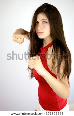 gorgeous female model with fist in action