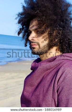 Cool man with long hair in the wind