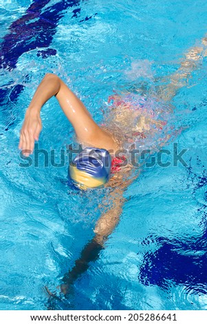 Sport woman training swimming in swimming pool