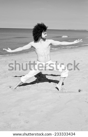 Cool shirtless man doing yoga black and white