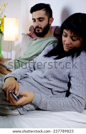 Man jealous of woman texting message