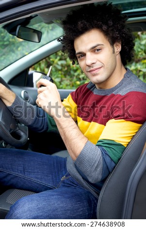 Cool young man in new car