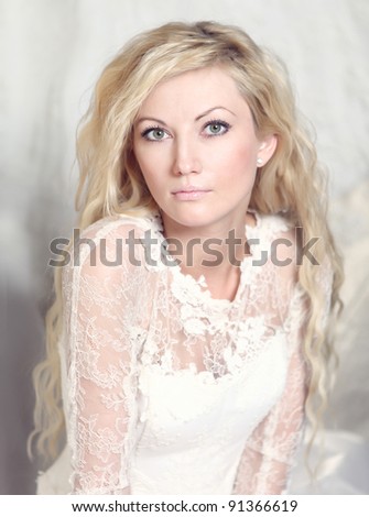 portrait of bride with blond curly hair